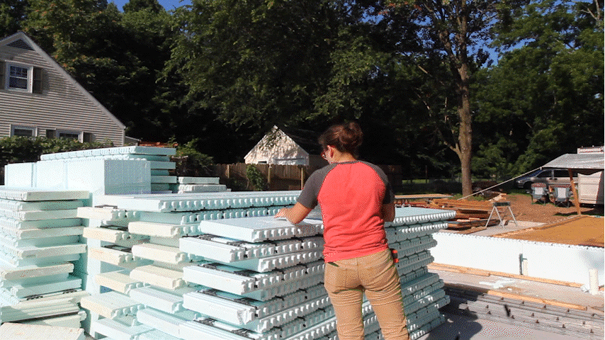 Gif of person sawing Nudura ICF and carrying it away